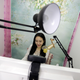 Online hostess Sun Xiaohou smiles as she gives a live broadcast in Beijing